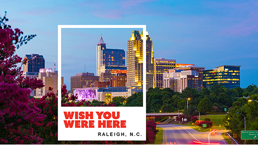 A photo of Raleigh's skyline with Wish You Were Here