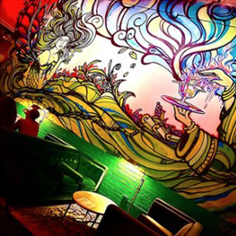 A colorful, flowing mural in Aunty Betty's Gin & Absinthe Bar