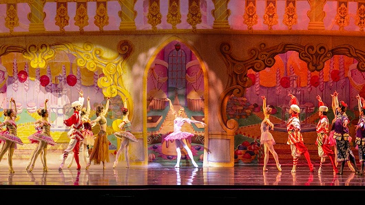 Ten ballet dancers form a line across the stage as they dance in part of 'The Nutcracker'