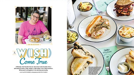 A two-page magazine spread that on the left featured white man wearing pinkish tee shirt sitting at table in front of food smiling at camera, and on the right features a top-down view of a table filled with sandwiches atop white plates
