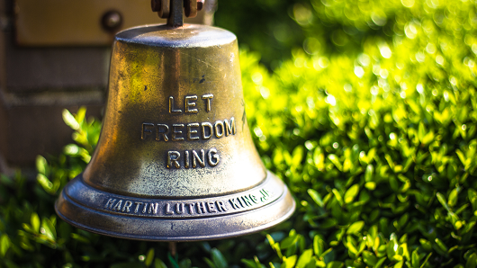 A memorial bell with Martin Luther King Jr.'s name and the words LET FREEDOM RING