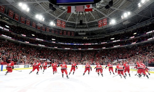 Carolina Hurricanes hockey team skating down the ice in PNC Arena
