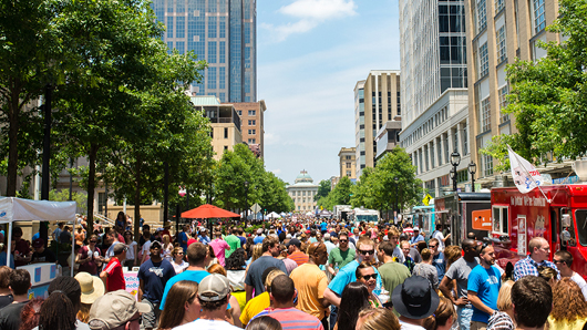 Large crowd at a festival on Fayetteville St. in downtown Raleigh