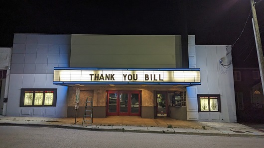 Image of the outside of the Rialto Theatre with marquee that reads "THANK YOU BILL" as an ode to the former owner who retired in 2022