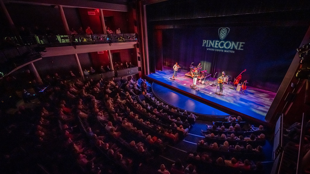 A sold-out crowd at the Martin Marietta Center for the Performing Arts listens to a PineCone music performance.