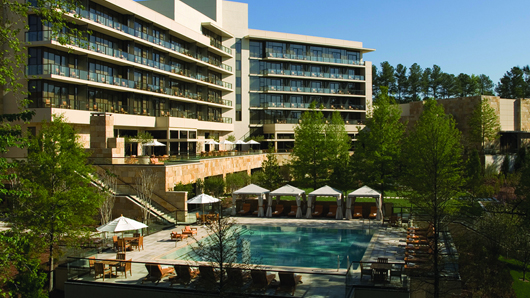 Back exterior of The Umstead Hotel, with the pool in the foreground