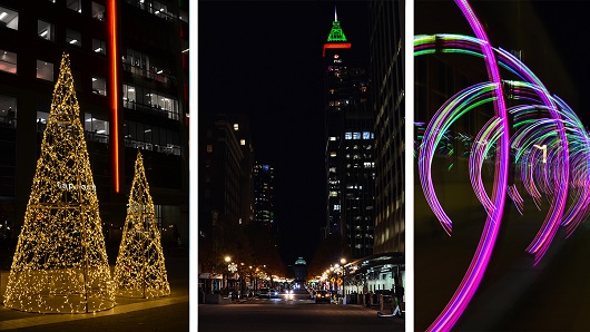 Glowing art objects in downtown Raleigh include twin Christmas trees and a special installation of a rings that form a tunnel for people to walk through