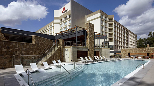 Exterior of the Raleigh Marriott Crabtree Valley with a pool in the foreground